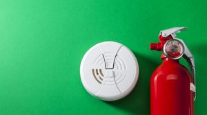 A smoke detector and fire extinguisher